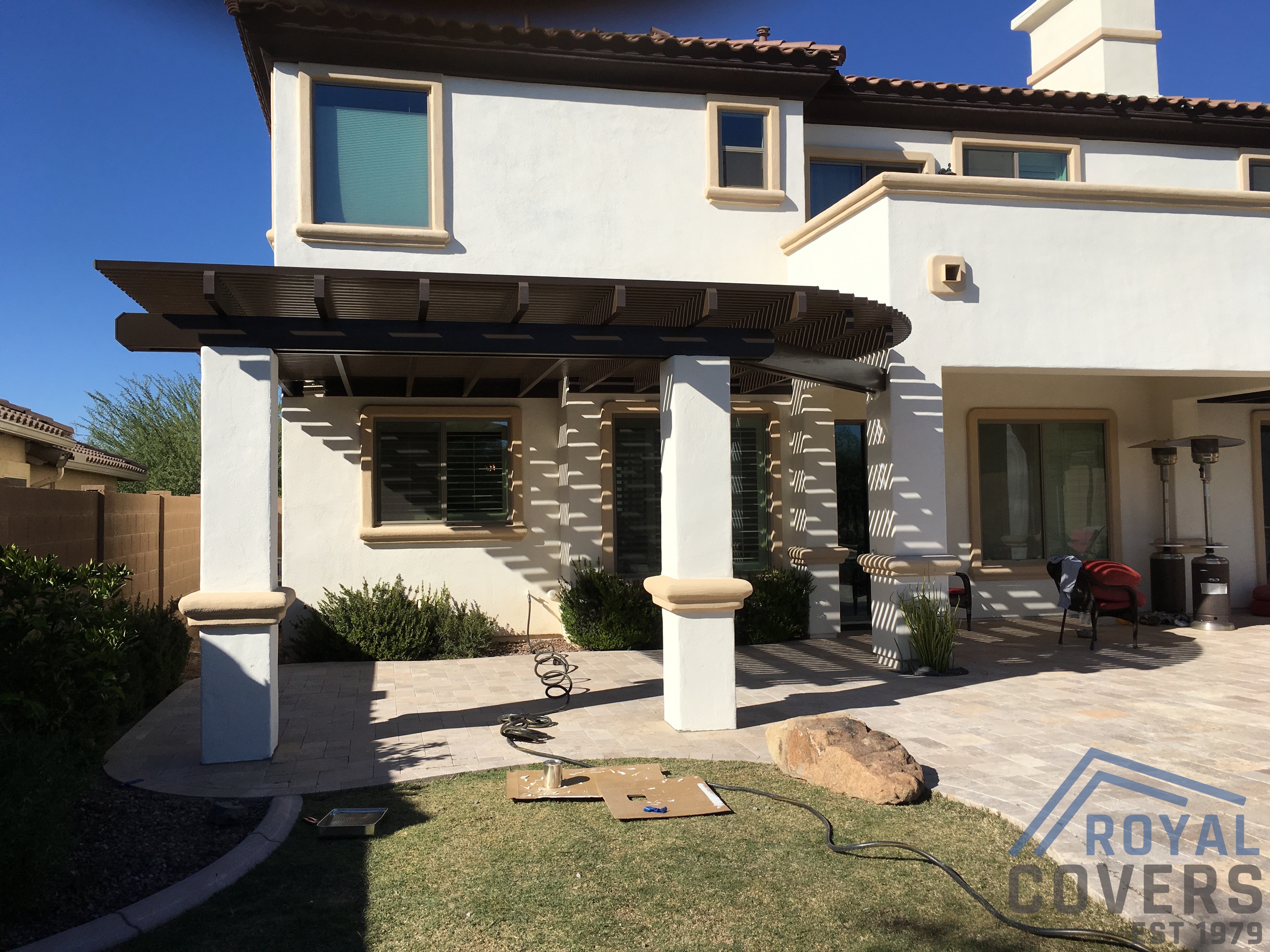 Modern Alumawood patio cover with insulated panels and motorized louver system.