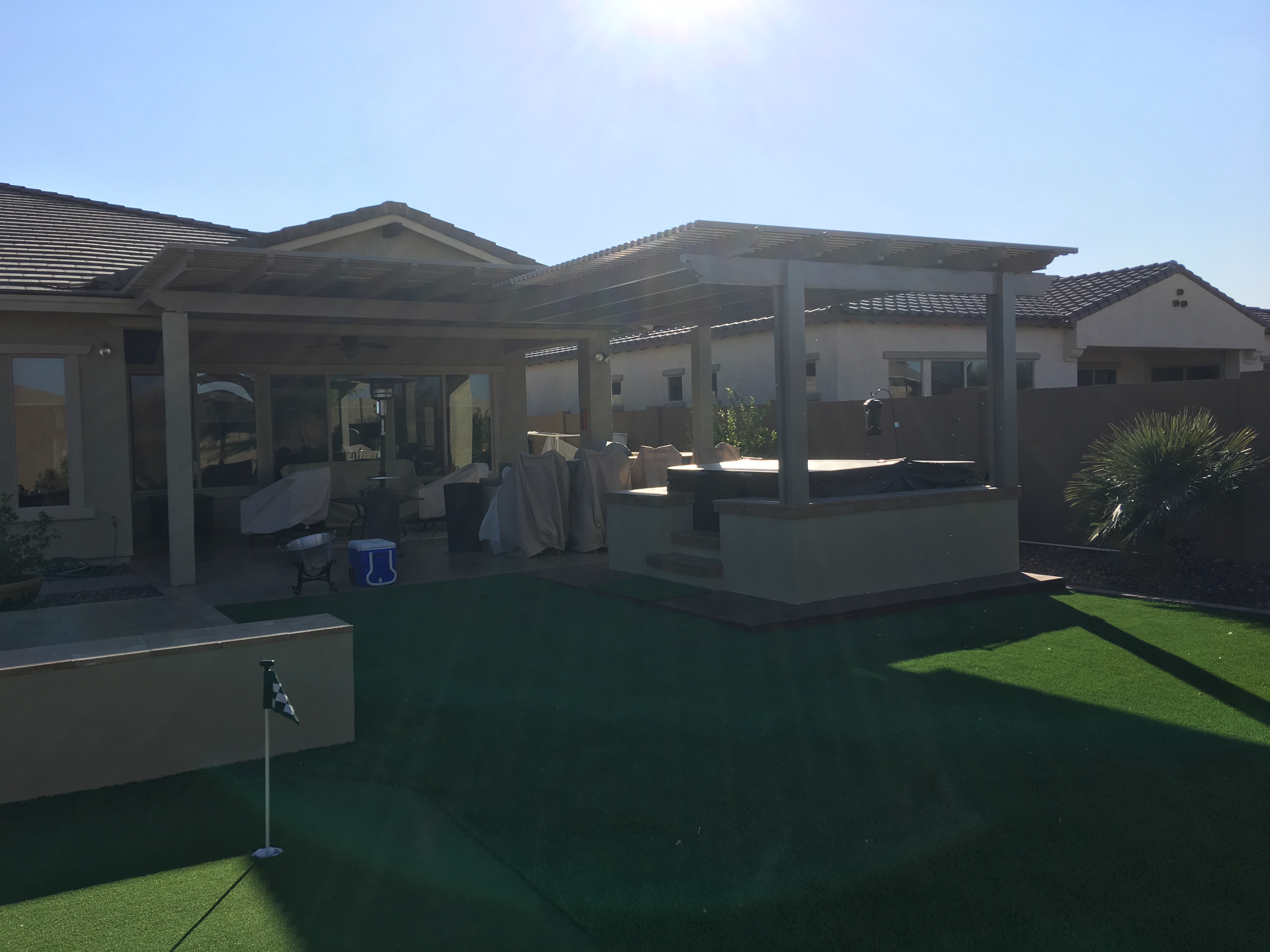 Modern Alumawood patio cover with insulated panels and motorized louver system.