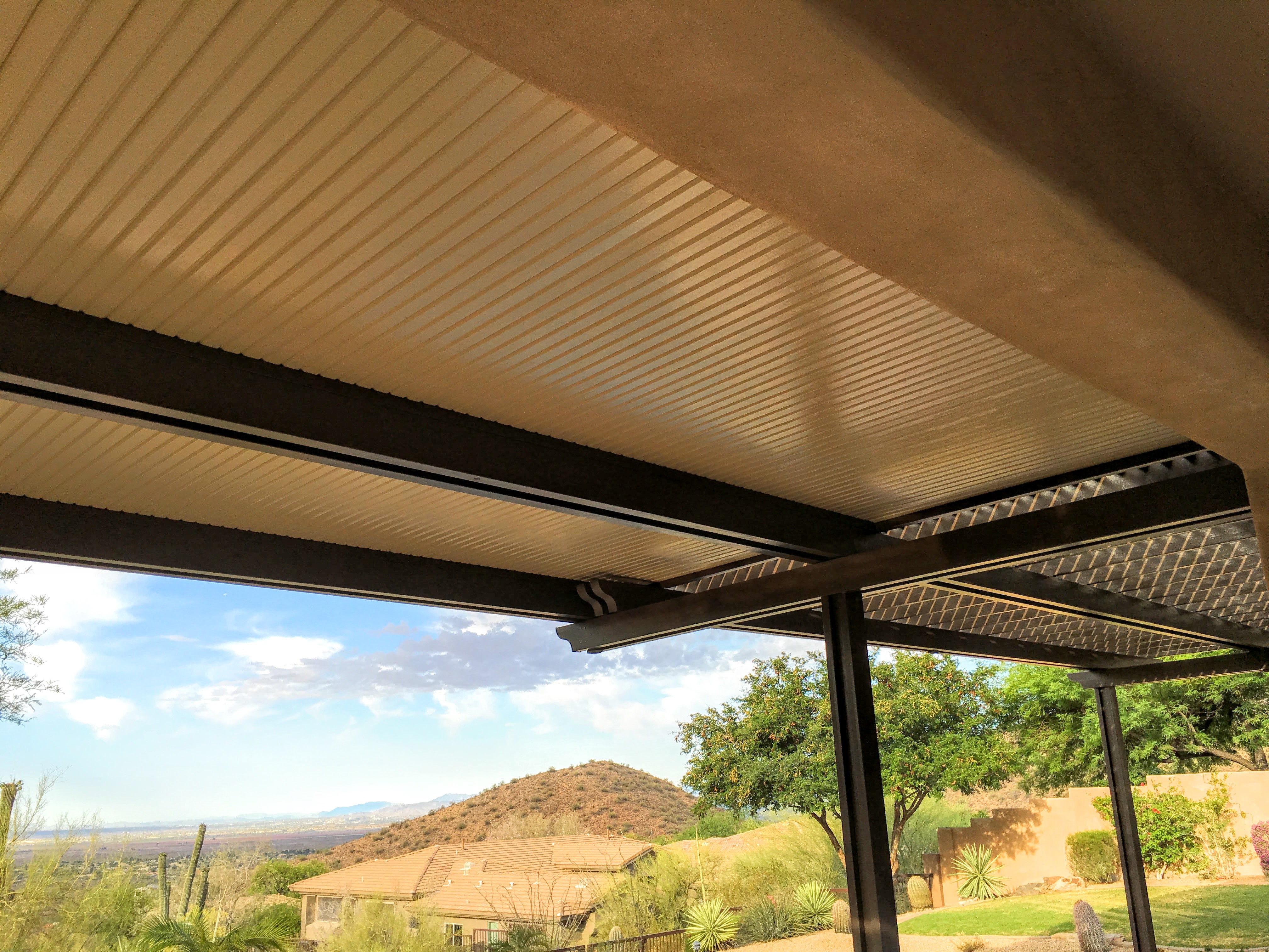 Modern Alumawood patio cover with insulated panels and motorized louver system.