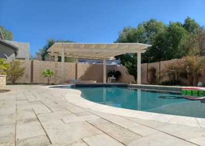 A photograph of a residential patio area featuring a newly installed Alumawood structure, emphasizing the clean lines and the aesthetic improvement it brings to the outdoor living space.