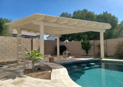 A photograph of a residential patio area featuring a newly installed Alumawood structure, emphasizing the clean lines and the aesthetic improvement it brings to the outdoor living space.